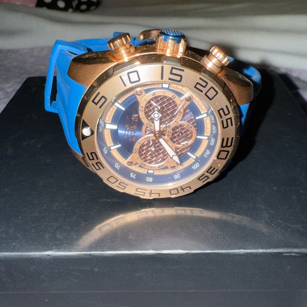 Invicta Watch with Blue Strap and Gold-Tone Dial
